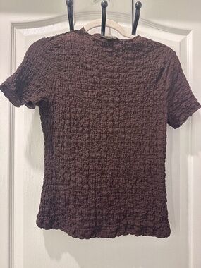 Brown top with rushing